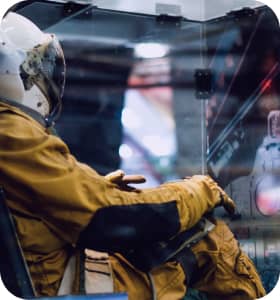 an astronaut sitting in a rocket simulator