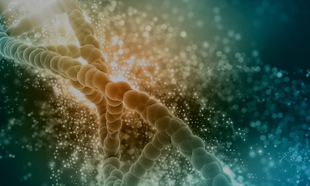 a dna string surrounded by green, orange and blue glittering colors