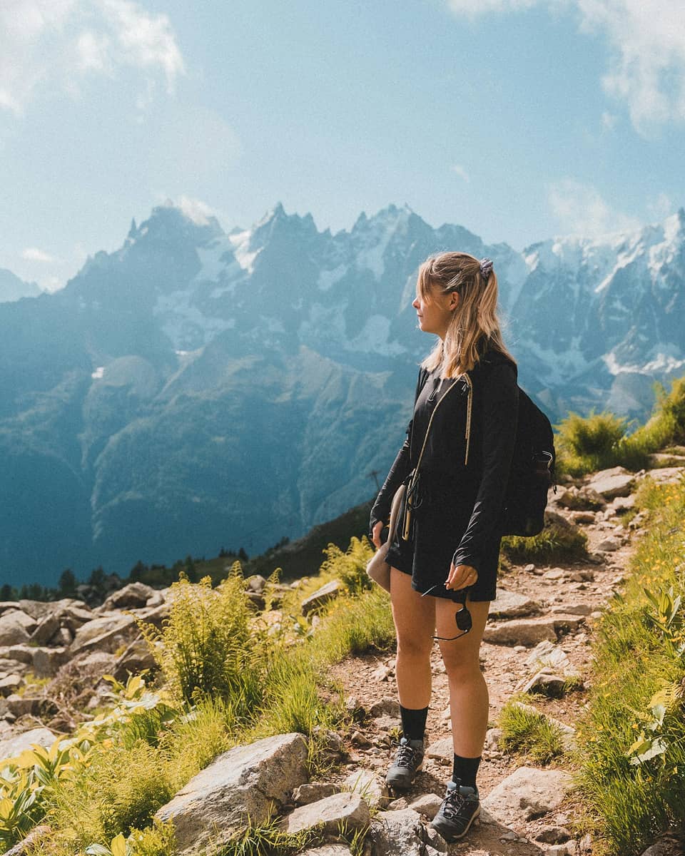 woman on top of a mountain trail
